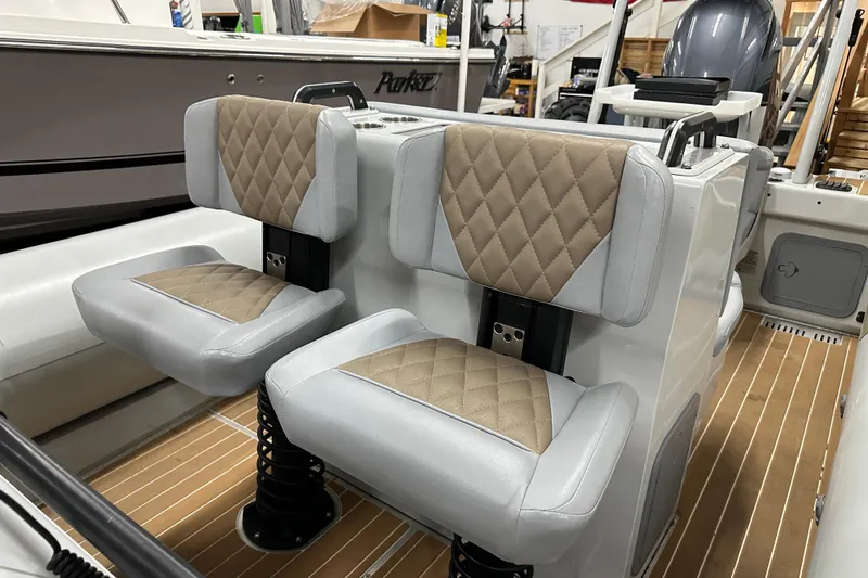Slide: The Image of Sealegs 7.5M 2022 boat interior with cushioned seats and modern design. - 9