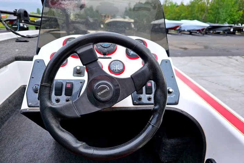 Slide: The Image of Steering wheel and dashboard of 1998 Champion 187 DLX Elite boat. - 20