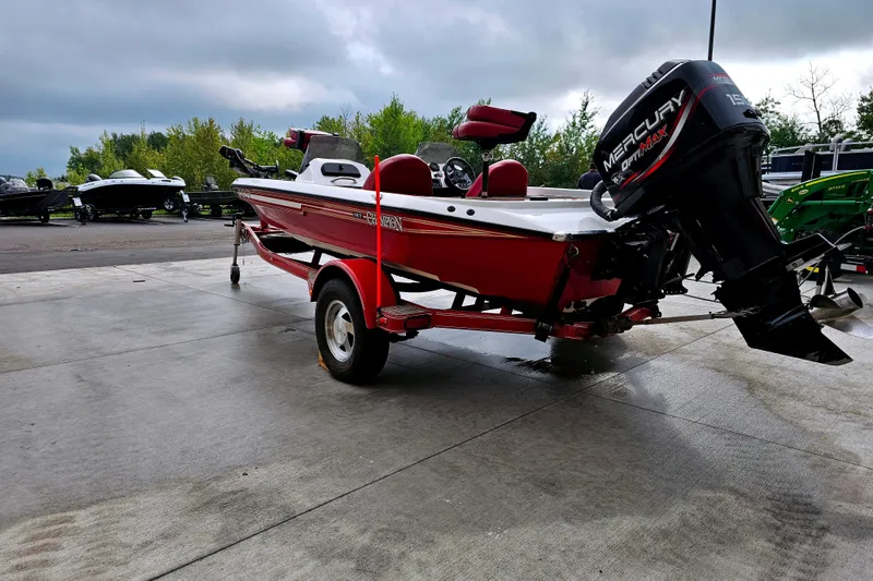 Slide: The Image of 1998 Champion 187 DLX Elite boat with Mercury OptiMax engine on trailer. - 3