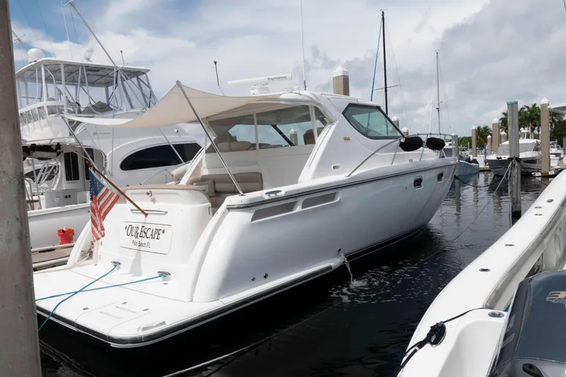 Slide: The Image of 2007 Tiara Yachts 4300 Sovran docked at marina, rear view with American flag. - 1