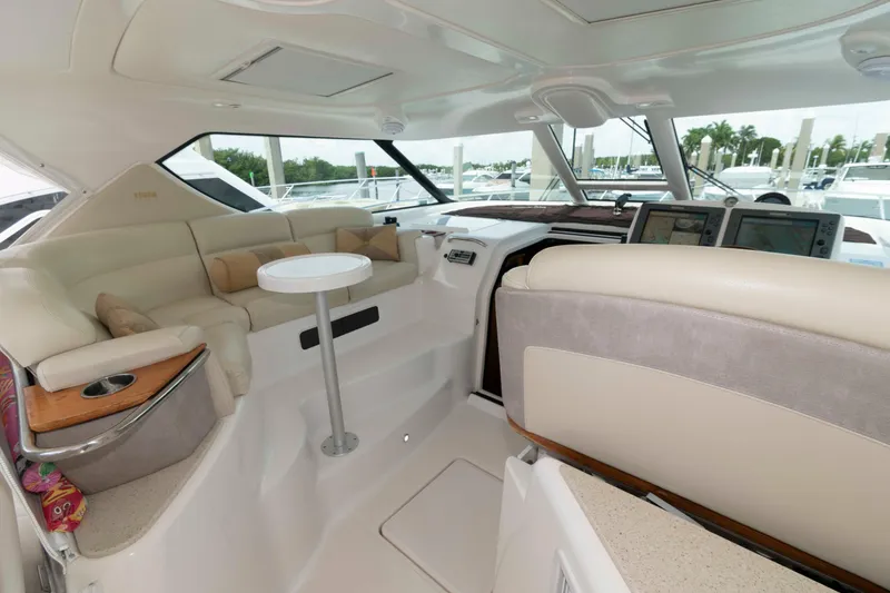 Slide: The Image of Luxurious interior of 2007 Tiara Yachts 4300 Sovran with plush seating and navigation equipment. - 10