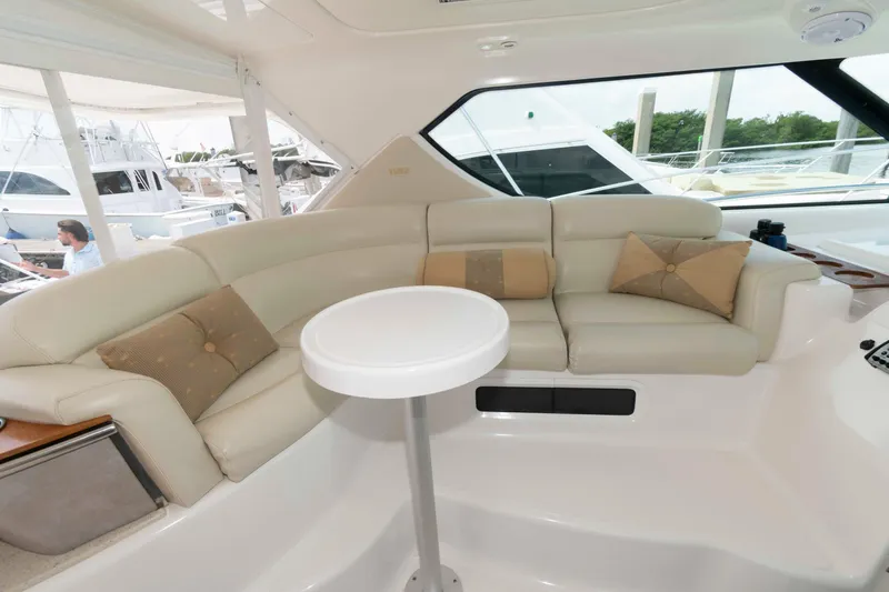 Slide: The Image of Luxurious interior of 2007 Tiara Yachts 4300 Sovran with plush seating and table. - 11