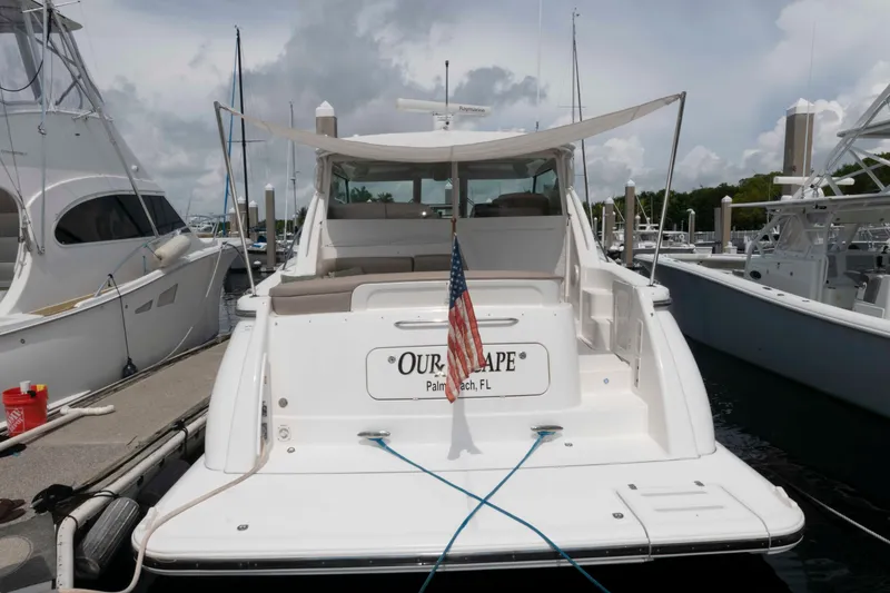 Slide: The Image of 2007 Tiara Yachts 4300 Sovran docked, rear view with American flag. - 15