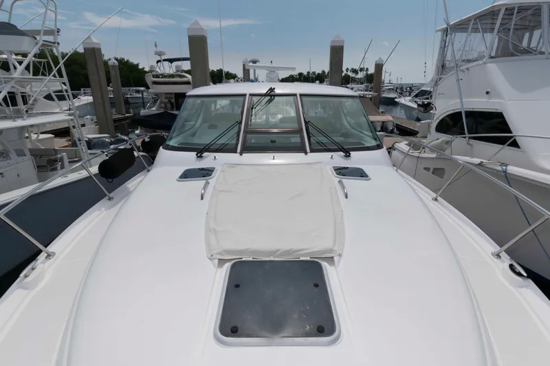 Slide: The Image of 2007 Tiara Yachts 4300 Sovran docked at marina, front deck view. - 17