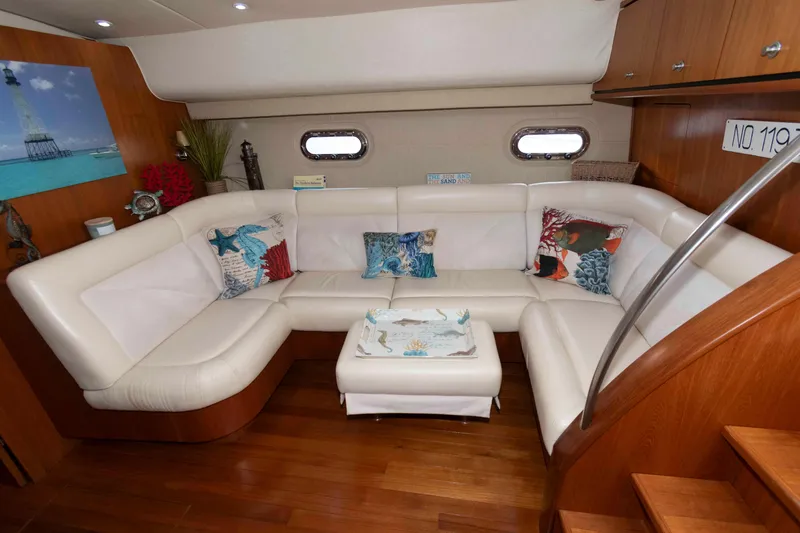 Slide: The Image of Luxurious interior of 2007 Tiara Yachts 4300 Sovran with white leather seating and nautical decor. - 21