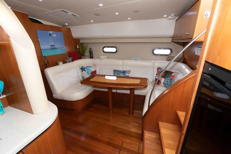 Slide: The Image of Luxurious interior of 2007 Tiara Yachts 4300 Sovran with elegant seating and wooden finishes. - 22