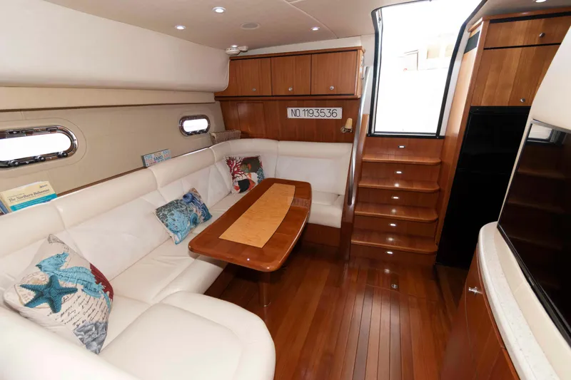 Slide: The Image of Luxurious interior of 2007 Tiara Yachts 4300 Sovran with elegant seating and wooden finishes. - 23