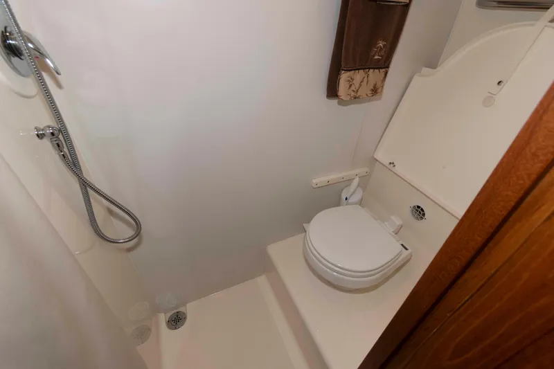 Slide: The Image of Bathroom interior of 2007 Tiara Yachts 4300 Sovran, featuring shower and toilet. - 30