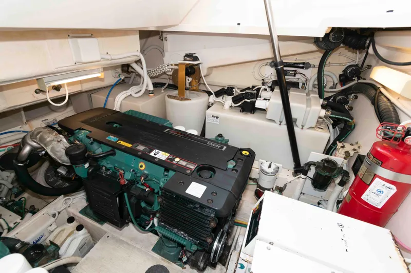 Slide: The Image of Engine room of 2007 Tiara Yachts 4300 Sovran, featuring mechanical components and fire extinguisher. - 32