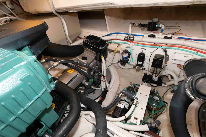 Slide: The Image of Engine room of 2007 Tiara Yachts 4300 Sovran, showcasing mechanical components and wiring. - 33