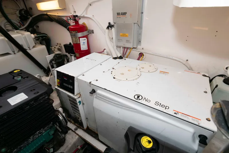 Slide: The Image of Engine room of 2007 Tiara Yachts 4300 Sovran with generator and fire extinguisher. - 35