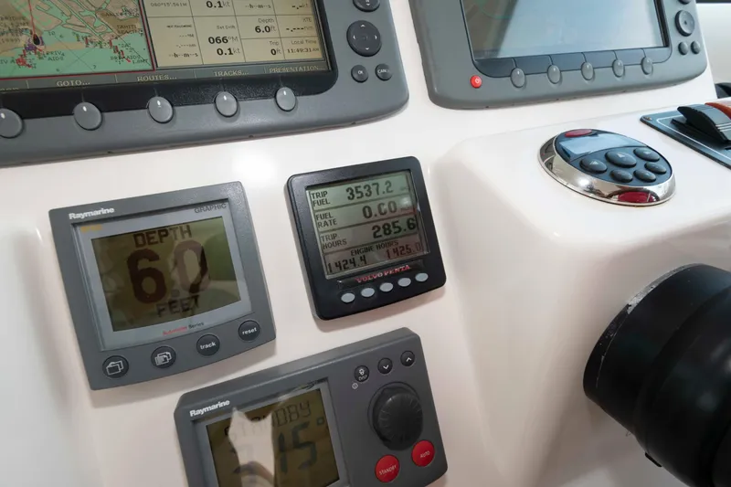 Slide: The Image of Dashboard of a 2007 Tiara Yachts 4300 Sovran with navigation and depth displays. - 36