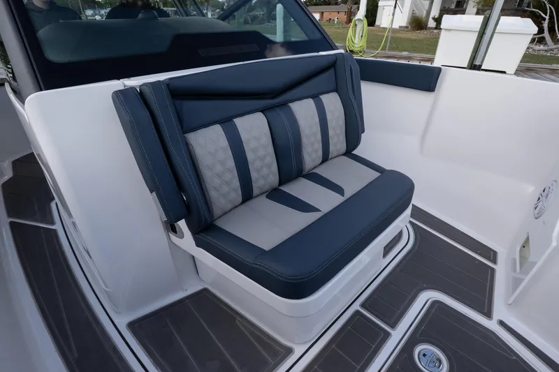 Slide: The Image of 2026 Monterey Elite 27 OB boat interior with stylish seating and modern design. - 16