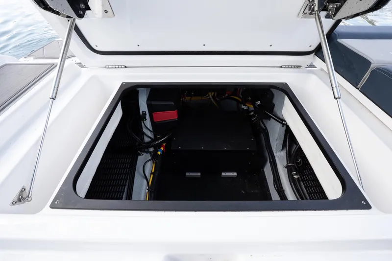 Slide: The Image of Open engine compartment of 2026 Monterey Elite 27 OB boat, showcasing internal components. - 19