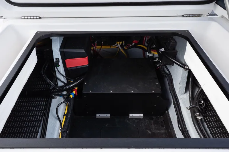 Slide: The Image of Engine compartment of 2026 Monterey Elite 27 OB boat, showcasing wiring and components. - 20