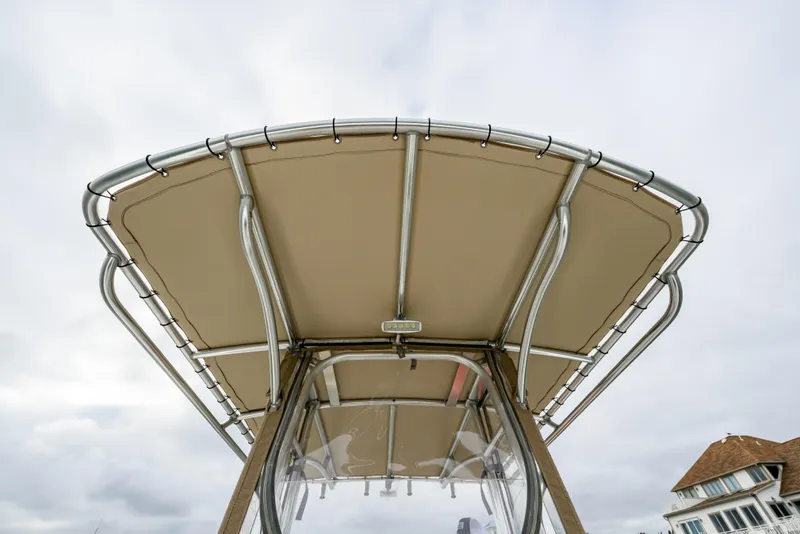Slide: The Image of Parker 21 Special Edition 2018 boat canopy with metal frame against cloudy sky. - 11