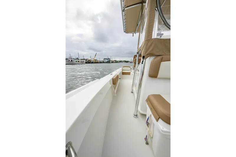 Slide: The Image of Parker 21 Special Edition boat, 2018 model, docked with beige seating and overcast sky. - 14