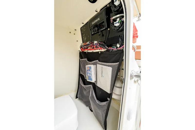 Slide: The Image of Interior of 2018 Parker 21 Special Edition boat with organized storage and Garmin electronics. - 18