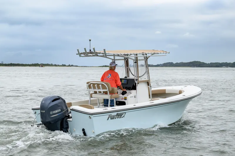 Slide: The Image of 2018 Parker 21 Special Edition boat cruising on water with Yamaha engine. - 3