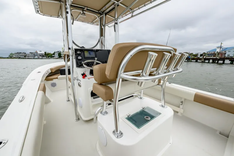 Slide: The Image of 2018 Parker 21 Special Edition boat interior with helm, rod holders, and seating. - 5