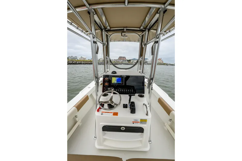 Slide: The Image of Parker 21 Special Edition 2018 boat console with steering wheel and navigation equipment. - 7