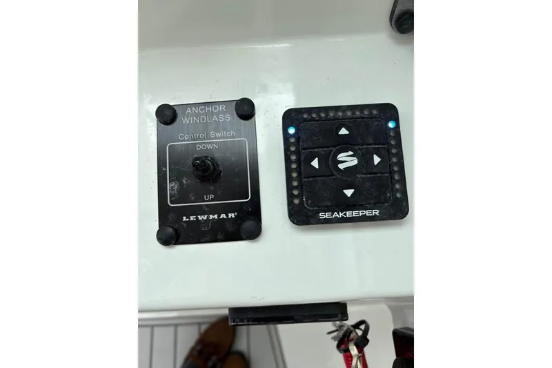 Slide: The Image of 2026 Parker 2420 Sport Cabin controls: Lewmar anchor windlass and Seakeeper stabilizer panel. - 5