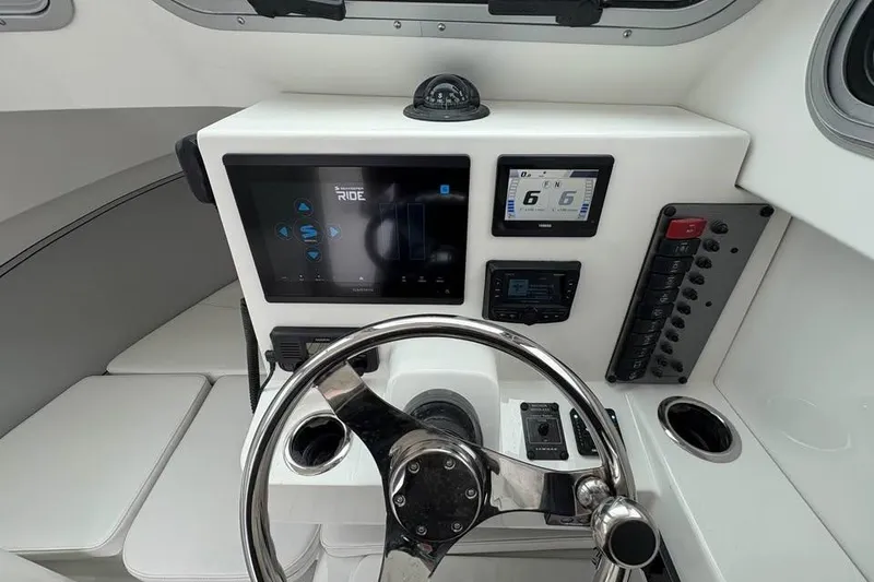 Slide: The Image of 2026 Parker 2420 Sport Cabin dashboard with modern controls and navigation displays. - 7