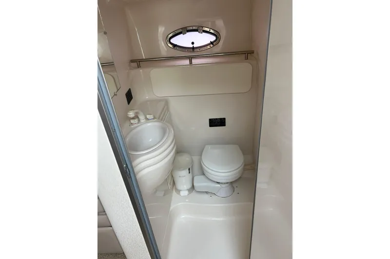 Slide: The Image of Compact bathroom in 2000 Maxum 3000 SCR boat with toilet and sink. - 13