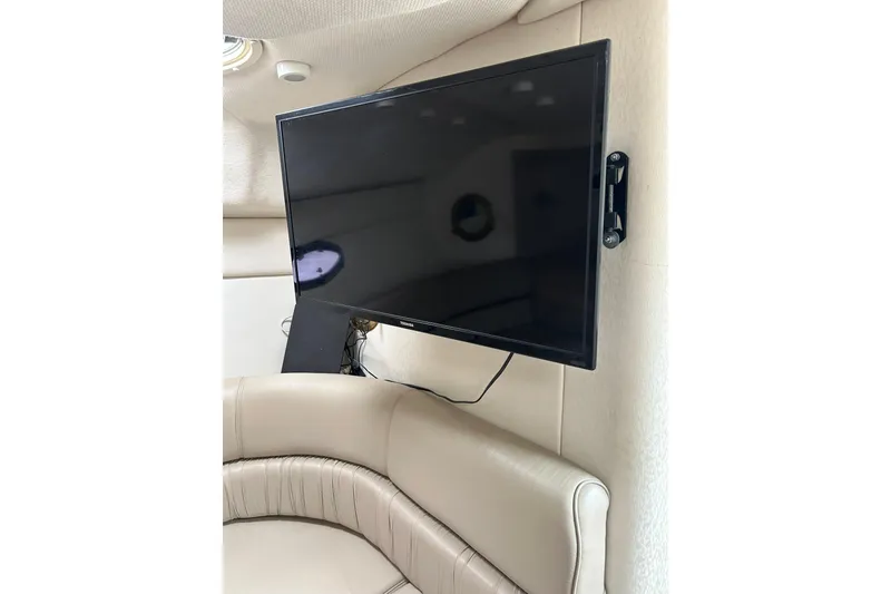 Slide: The Image of Flat-screen TV mounted in a 2000 Maxum 3000 SCR boat interior. - 15