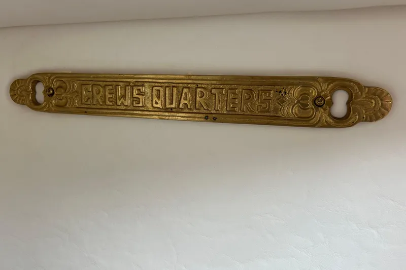 Slide: The Image of "Crews Quarters" brass sign on Maxum 3000 SCR, 2000 model boat interior. - 17