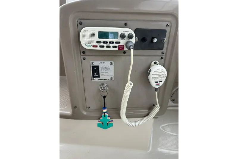 Slide: The Image of Control panel of a 2000 Maxum 3000 SCR boat with radio and anchor controls. - 25