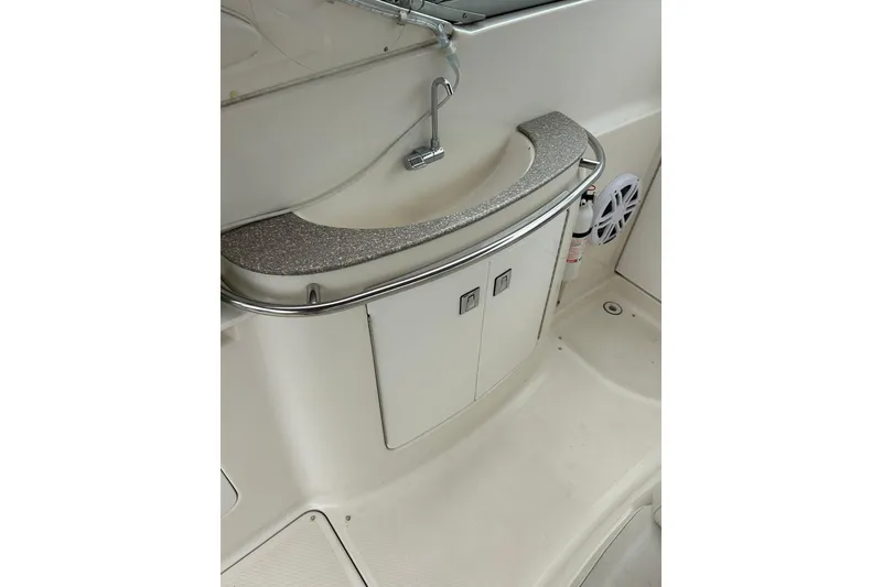 Slide: The Image of 2000 Maxum 3000 SCR boat interior with sink and storage cabinets. - 26