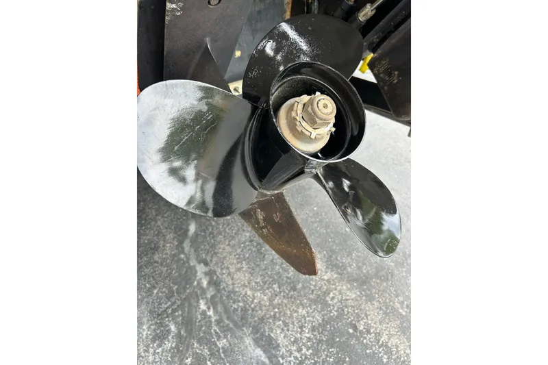 Slide: The Image of Propeller of 2000 Maxum 3000 SCR boat on pavement background. - 29