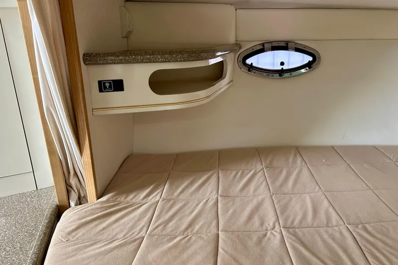 Slide: The Image of Interior cabin of 2000 Maxum 3000 SCR boat with bed and porthole window. - 5