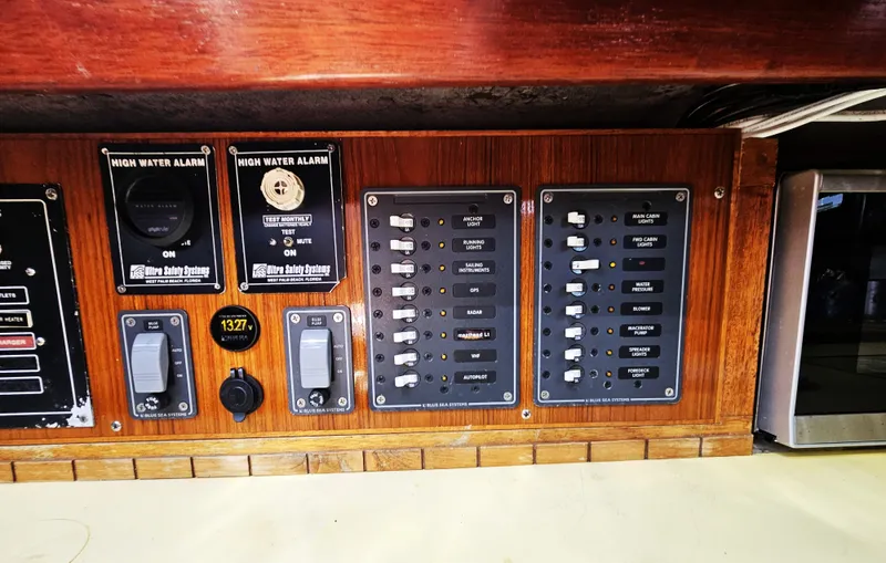 Slide: The Image of Control panel of a 1967 Jensen Cal 36 sailboat with high water alarms and switches. - 28