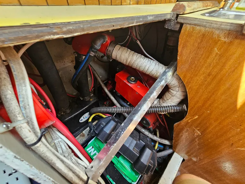 Slide: The Image of Engine compartment of a 1967 Jensen Cal 36 sailboat, showing wiring and components. - 33