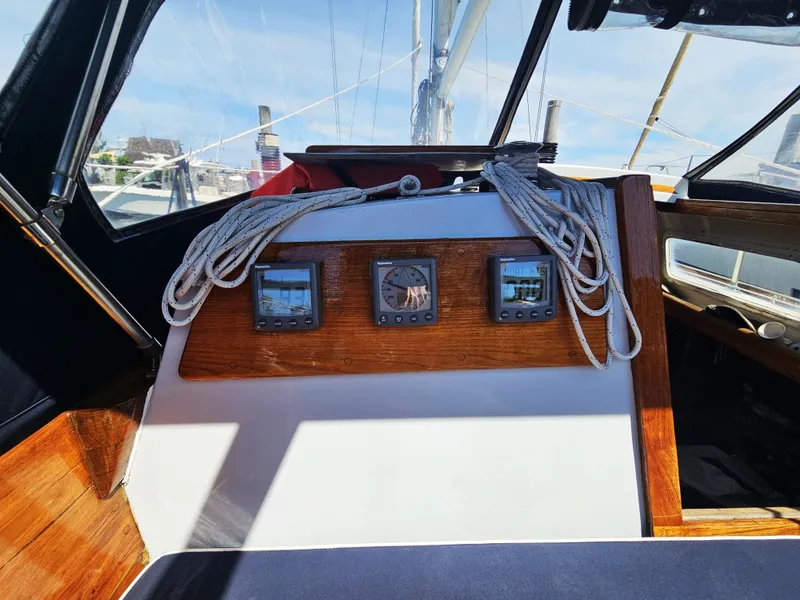 Slide: The Image of Cockpit of 1967 Jensen Cal 36 sailboat with navigation instruments and ropes. - 13