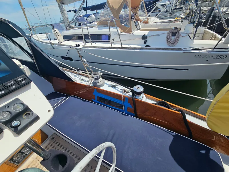 Slide: The Image of Sailboats docked in marina, featuring a 1967 Jensen Cal 36. - 10