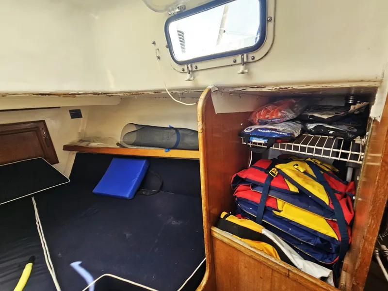 Slide: The Image of Interior of a 1967 Jensen Cal 36 sailboat with storage and sleeping area. - 19