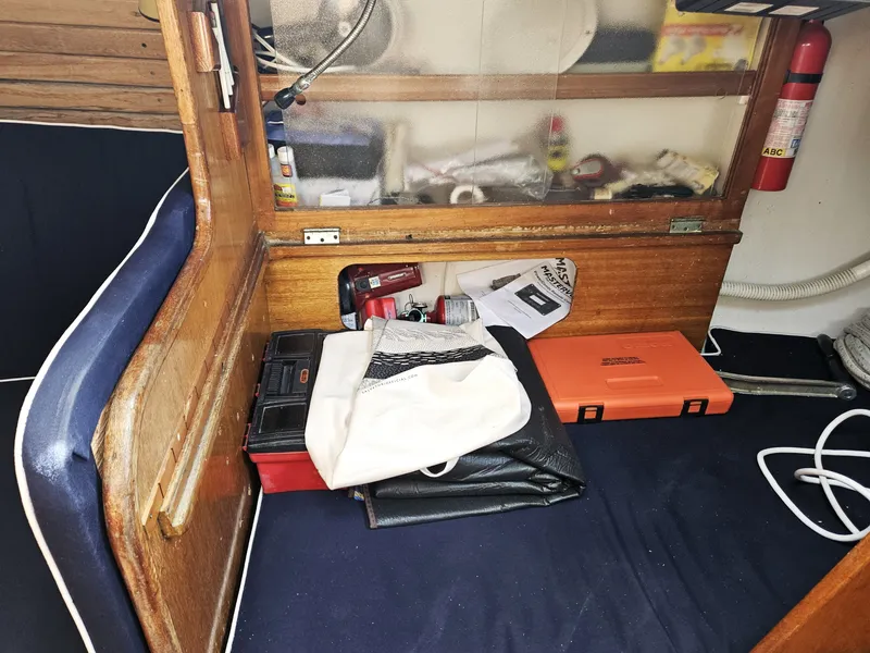 Slide: The Image of Interior of 1967 Jensen Cal 36 sailboat with storage and safety equipment. - 24