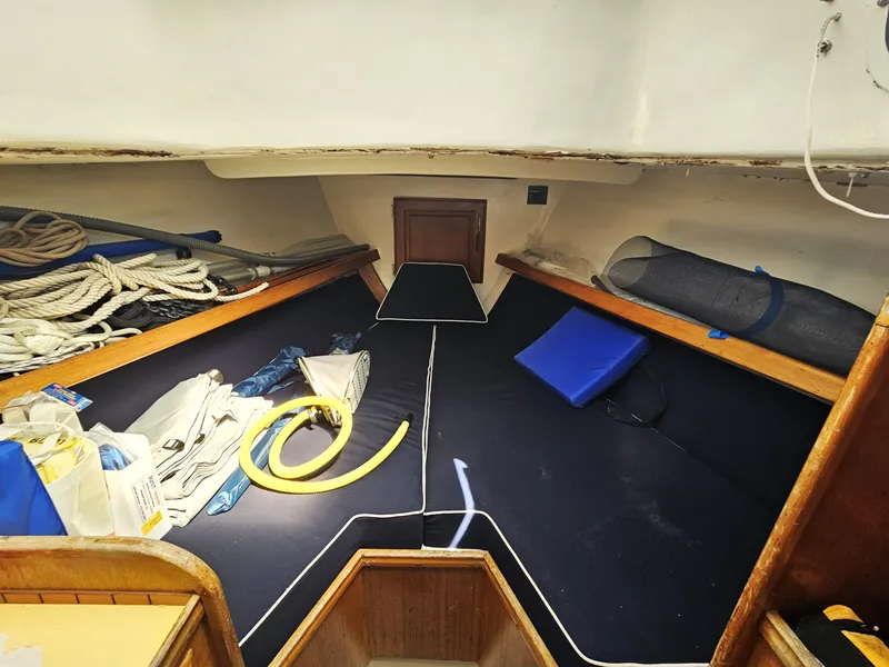 Slide: The Image of Interior of a 1967 Jensen Cal 36 sailboat with ropes and equipment. - 17