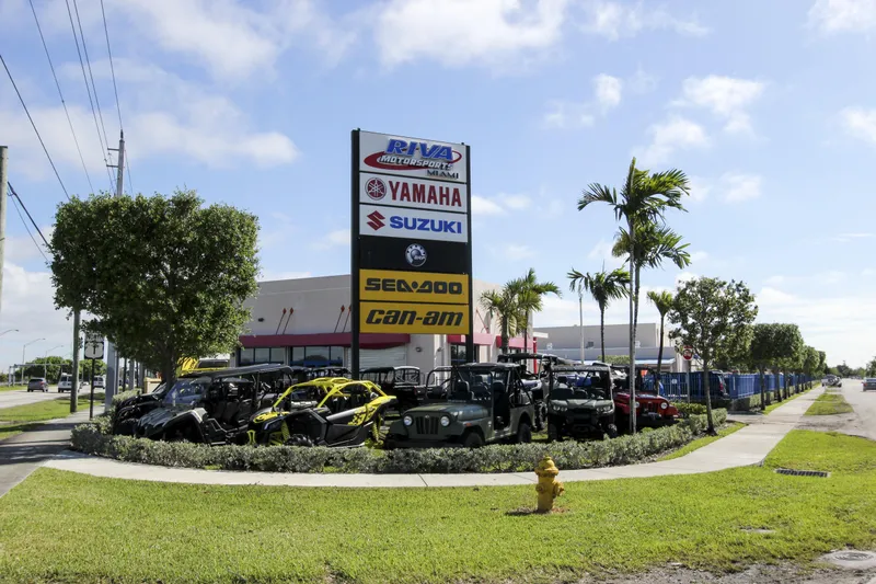 Slide: The Image of Outdoor display of Yamaha, Suzuki, Sea-Doo, and Can-Am vehicles at Riva Motorsports dealership. - 8