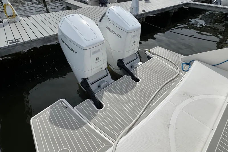 Slide: The Image of 2023 Tiara Yachts 43 LS with dual Mercury outboard engines at dock. - 16