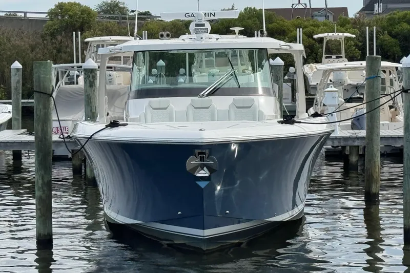 Slide: The Image of 2023 Tiara Yachts 43 LS docked, front view, sleek design, luxury boat. - 3