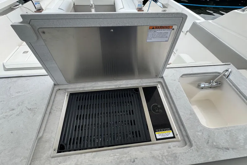 Slide: The Image of Outdoor grill and sink on 2023 Tiara Yachts 43 LS, featuring modern design and functionality. - 30
