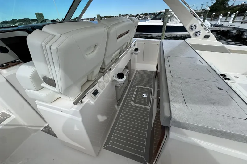 Slide: The Image of 2023 Tiara Yachts 43 LS interior with luxurious seating and sleek design. - 37