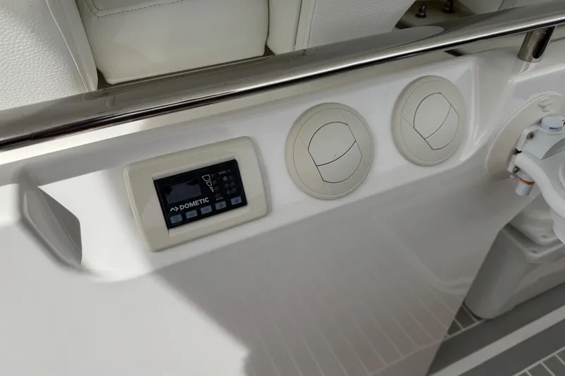 Slide: The Image of Control panel on 2023 Tiara Yachts 43 LS, featuring Dometic system and air vents. - 39