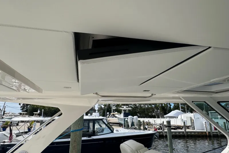 Slide: The Image of 2023 Tiara Yachts 43 LS interior ceiling detail at marina. - 45