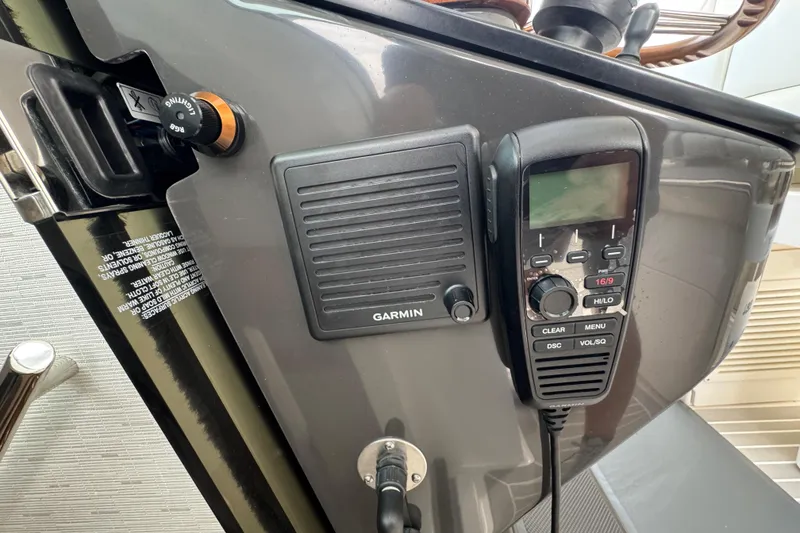 Slide: The Image of Control panel of 2023 Tiara Yachts 43 LS with Garmin marine radio. - 47