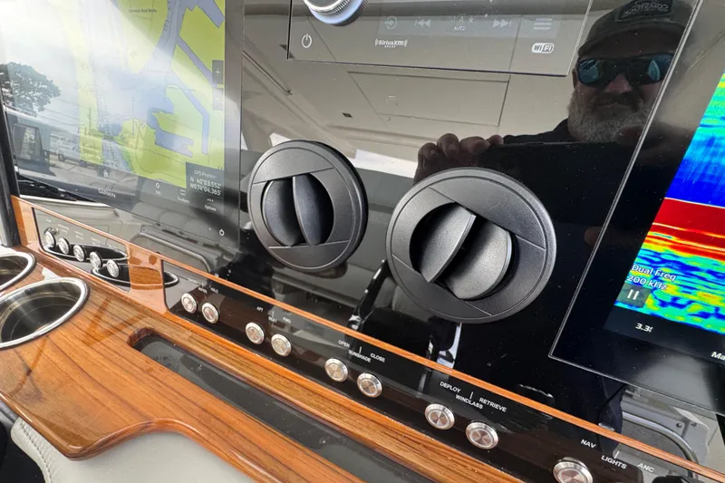 Slide: The Image of 2023 Tiara Yachts 43 LS dashboard with navigation and control panels. - 48